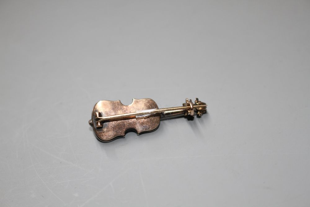 A late Victorian yellow and white metal and rose cut diamond set novelty brooch, modelled as a violin,